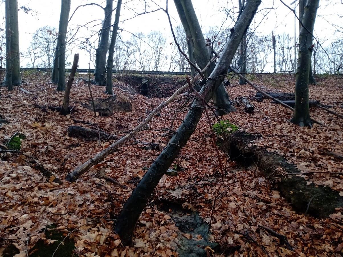 Foto 2: uitspoeling en taludgoot langsheen E411 die hersteld worden